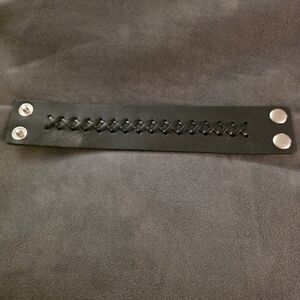 Black Faux Leather Bracelet with Snap Closure.